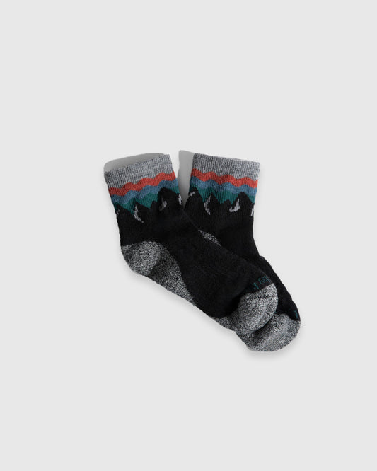 Black Mountainscape Merino Wool - Quarter Sock - New Color (Flat-lay): Black quarter socks with red, teal and grey mountain knit band