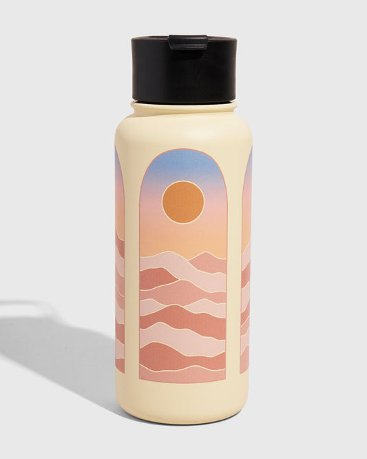 Eggshell - Sunrise Bottle - 32 Oz. Insulated Stainless Steel (Front): Cream insulated bottle with arch sunset desert landscape graphic, black lid