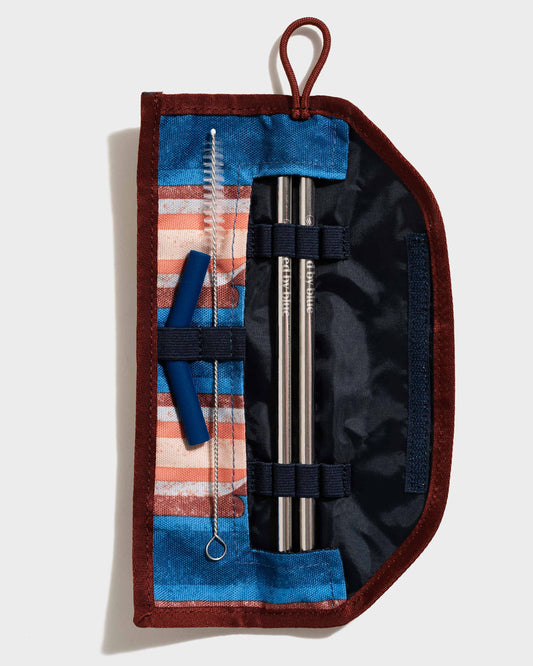 Pink The Straw Kit (Flat-lay): Open roll-up pouch with two steel straws, brush, and blue silicone tips