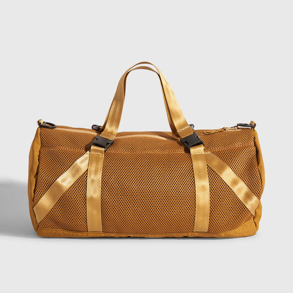 Smoky Orchre (Re)active™ 16L Mini Duffle (Front): Golden amber mesh duffle with nylon straps, buckle clips, and top handles