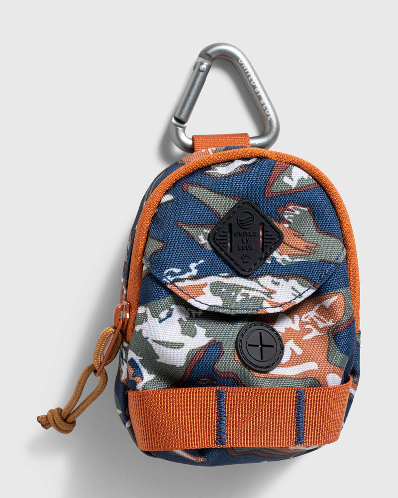 Lakeside Camo (R)evolution™ Dog Waste Bag Dispenser (Front): Mini camo backpack pouch with orange trim, front pocket, and silver carabiner