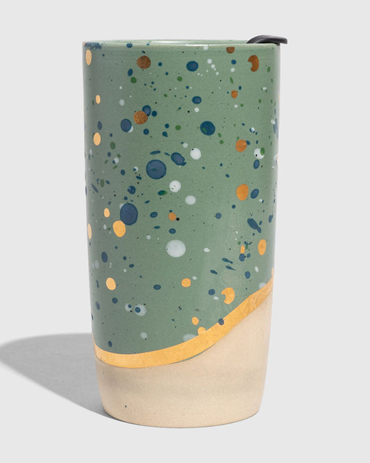 Juniper 10 oz. Insulated Stoneware Travel Mug (Angle): Sage green speckled tumbler with gold band and unglazed cream base