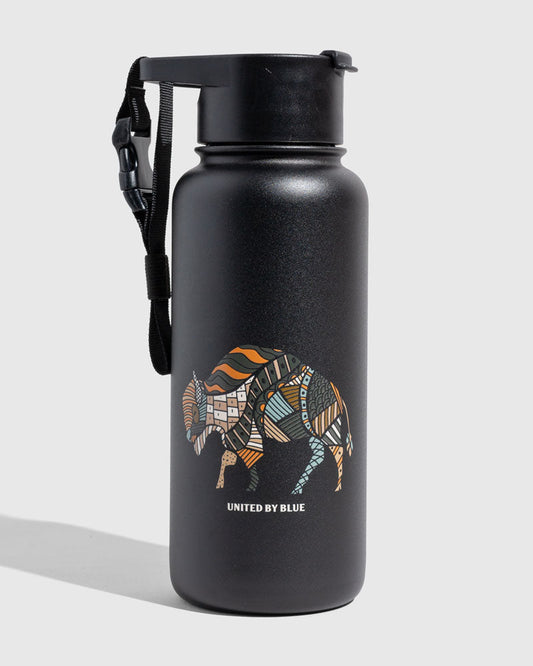 Black - Ink Bottle - 32 Oz. Insulated Stainless Steel (Angle): Matte black bottle with colorful patchwork bison graphic and carry strap