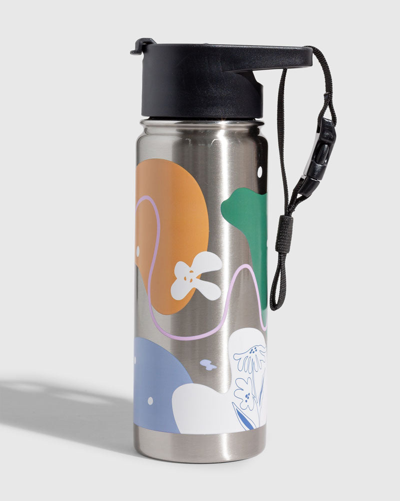Illuminate Insulated Steel Bottle 32 Oz. (Angle): Stainless steel bottle with colorful abstract shapes, black flip-top lid, wrist strap
