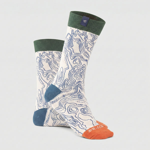 Shortbread IMPACT COLLECTION - Hemp Blend Socks (Angle): Cream crew socks with blue topographic lines, green cuff, orange toe, blue heel