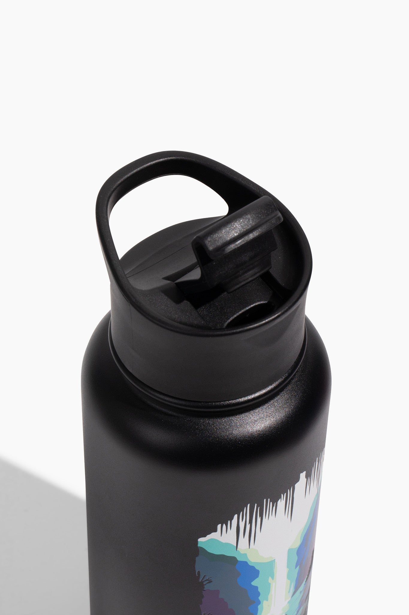 Black - Ink Bottle - 23 Oz. Insulated Stainless Steel (Detail): Black insulated bottle close-up with blue and white abstract ink graphic near carry handle lid