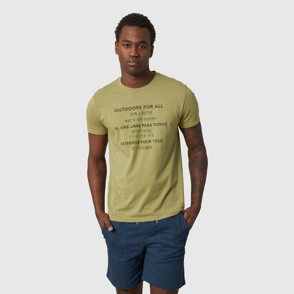 Sage Outdoors For All Graphic Tee (Front): Man wearing olive green tee with multilingual outdoor slogan graphic print