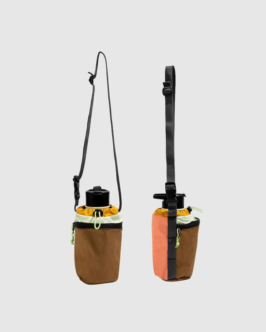 Coyote Coral Water Bottle Sling - Westward (Pre-Release) (Angle): Two bottle slings shown front and back, brown, coral, and cream colorblocking