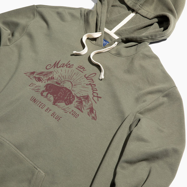 Dark Olive Bison Impact Hoodie (Detail): Olive hoodie with maroon bison graphic, cream drawstrings, kangaroo pocket visible