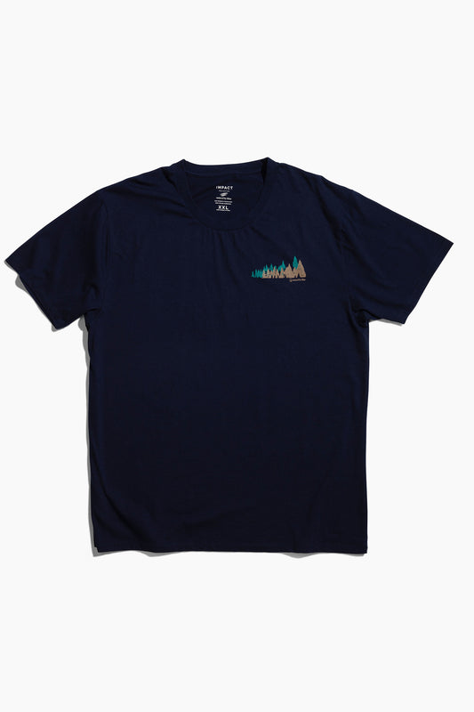 XS Moonlit Reflection Graphic Crew (Flat-lay): Navy blue crew neck tee with small forest trees graphic on chest