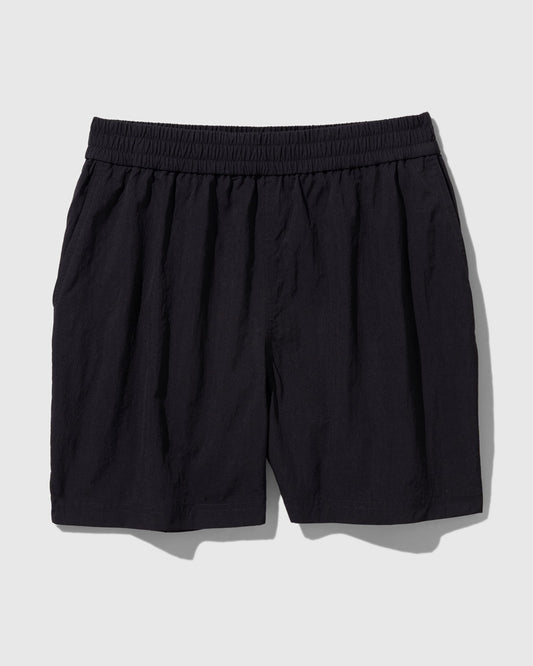 Black Recycled Sport Short (Flat-lay): Black elastic-waist shorts with side pockets and slightly crinkled fabric
