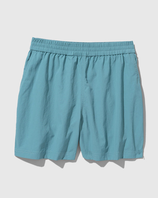 Teal Recycled Sport Short (Flat-lay): Teal elastic-waist shorts with center seam and side pockets visible
