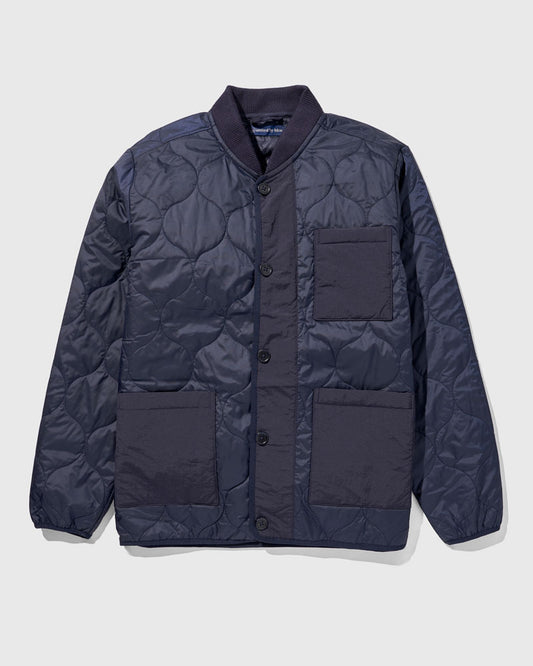 Night Sky Bison Ultralight Liner Jacket (Flat-lay): Navy quilted button-front jacket with ribbed collar and three patch pockets