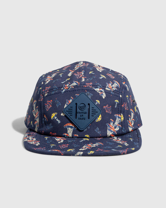Navy Mushrooms Organic 5-Panel Hat (Front): Navy five-panel cap with mushroom print and diamond logo patch centered