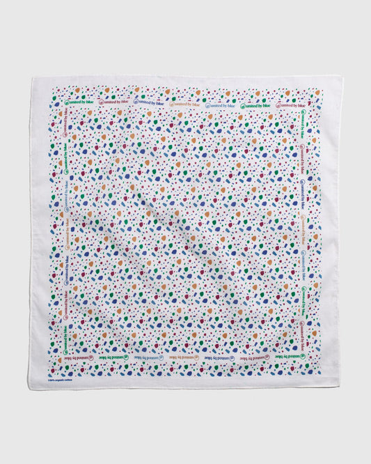 Egret Organic Bandana (Flat-lay): White bandana with multicolor abstract shapes and repeated brand text border