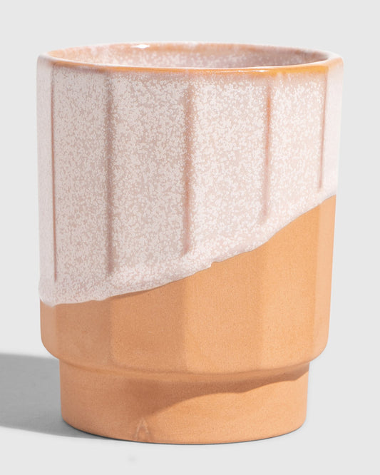 Foxglove 8 oz. Stackable Stoneware Tumbler (Angle): Ribbed stoneware cup with speckled blush glaze over terracotta base