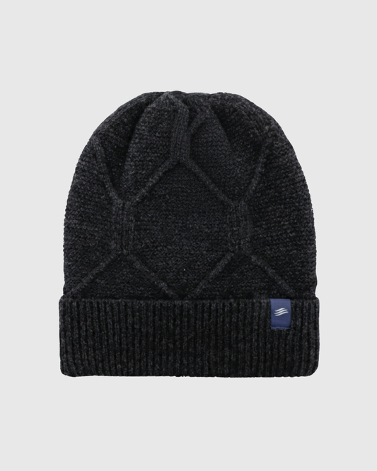 Charcoal Gray Yak Cable Knit Beanie (Front): Dark charcoal cable-knit beanie with diamond pattern and folded ribbed cuff, small blue logo patch on cuff right side
