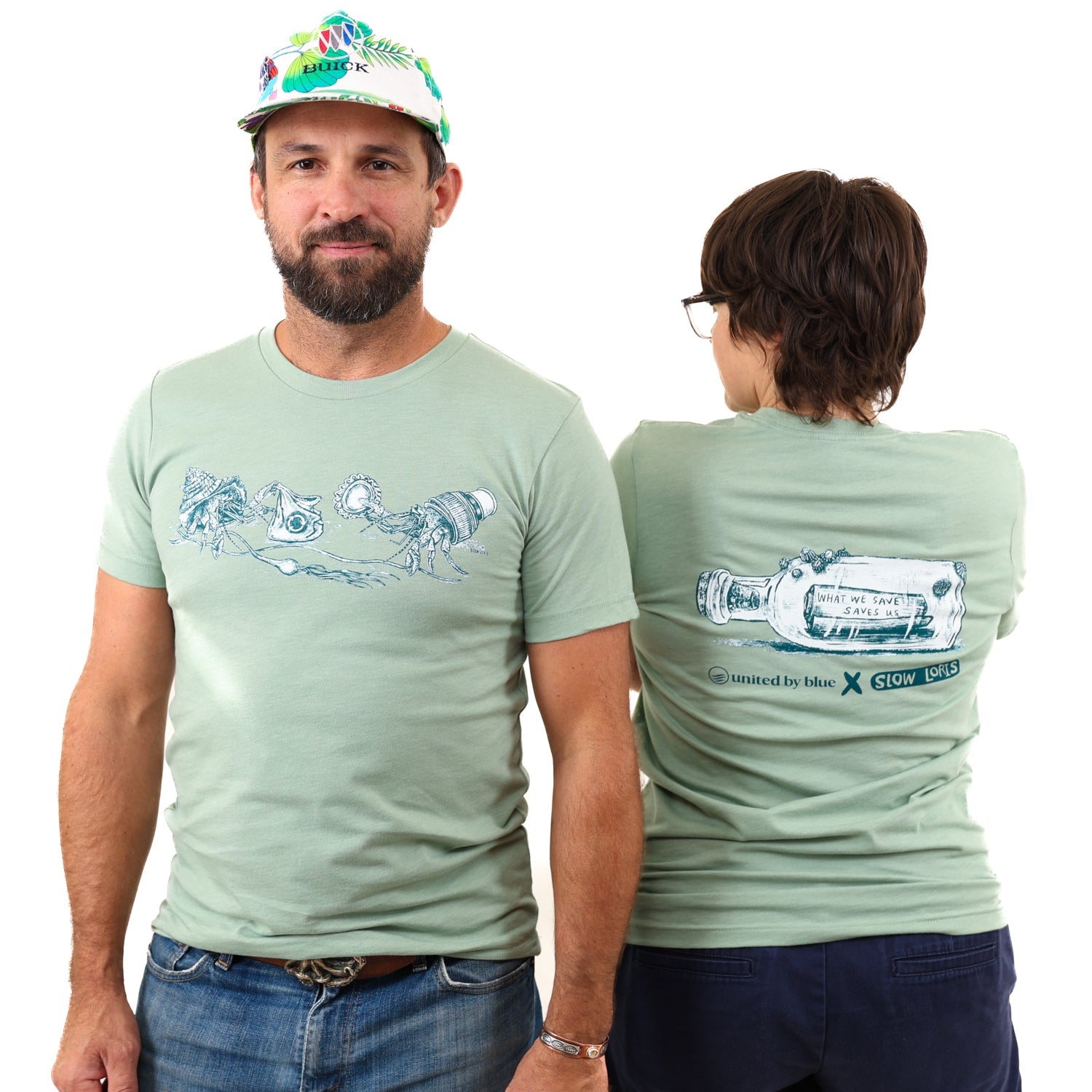 Heather Sage What We Save Graphic Tee - Slow Loris x United By Blue (In-use): Sage green tee, hermit crab front print, bottle message back graphic, two models