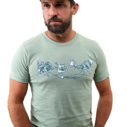 Heather Sage What We Save Graphic Tee - Slow Loris x United By Blue (In-use): Man wearing sage green tee with hermit crab ocean graphic print