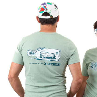 Heather Sage What We Save Graphic Tee - Slow Loris x United By Blue (Back): Sage green tee back with bottle graphic reading 'What We Save Saves Us'