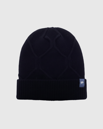 Navy Yak Cable Knit Beanie (Front): Dark navy knit beanie with cable pattern and ribbed cuff, small label