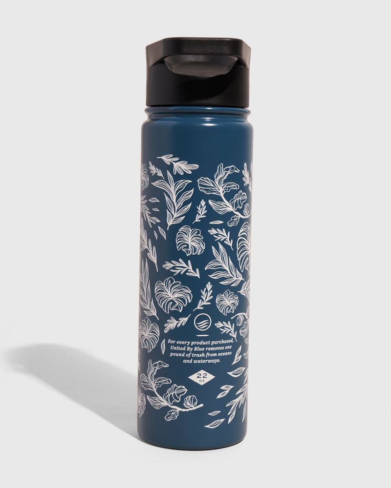 Rainstorm - Plants Bottle - 22 Oz. Insulated Stainless Steel (Front): Dark blue steel bottle with white botanical leaf prints and black lid