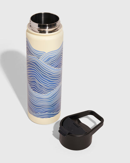 Eggshell - Waves Bottle - 22 Oz. Insulated Stainless Steel (Angle): Cream bottle with blue wave print, open top, black lid beside it