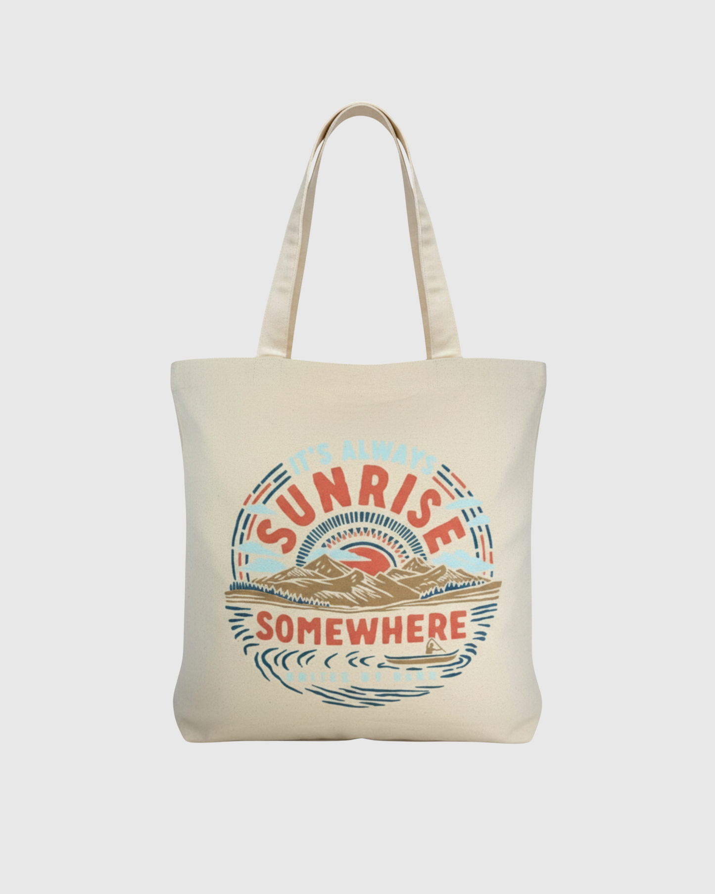It's Always Sunrise Somewhere My Favorite Daily Tote (Front): Natural canvas tote with circular sunrise landscape graphic in red, blue, tan