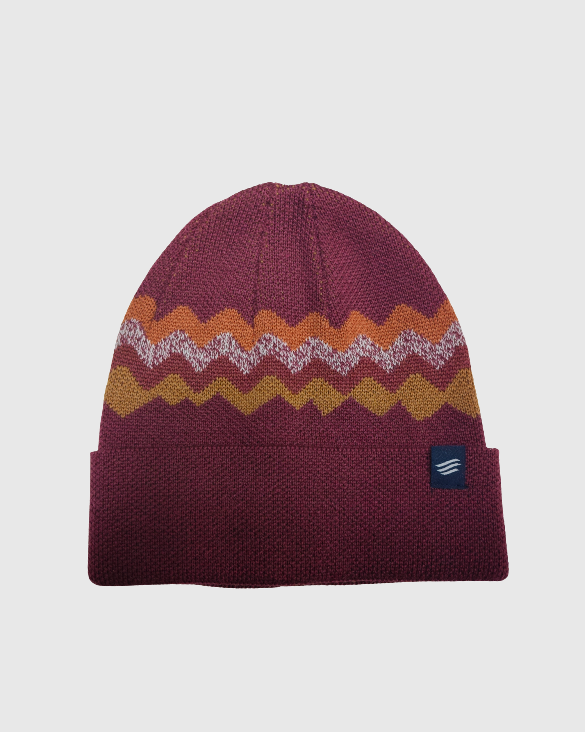 Burgundy Merino Wool Mountain Scape Knit Beanie (Front): Deep red beanie with zigzag mountain stripe pattern in orange, white, and gold