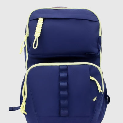 Blue (R)evolution™ 25L Transit Pack (Front): Navy blue backpack with neon yellow trim, braided zipper pulls, and webbing strap