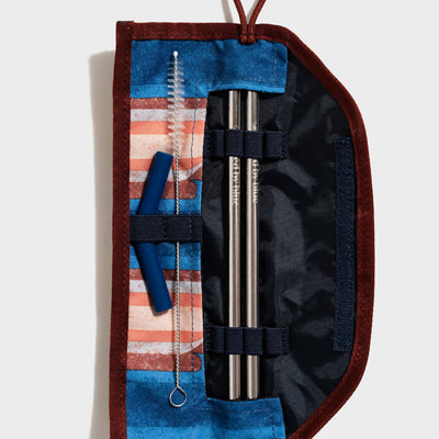 Pink The Straw Kit (Flat-lay): Open roll-up pouch with two steel straws, brush, and blue silicone tips