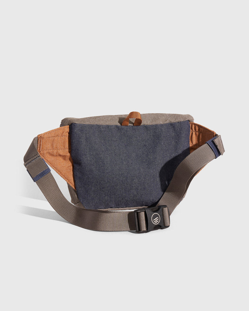 Camel Deadstock (R)evolution™ Canvas Fanny Pack (Back): Back view showing navy denim panel, camel side panels, brown adjustable strap with buckle