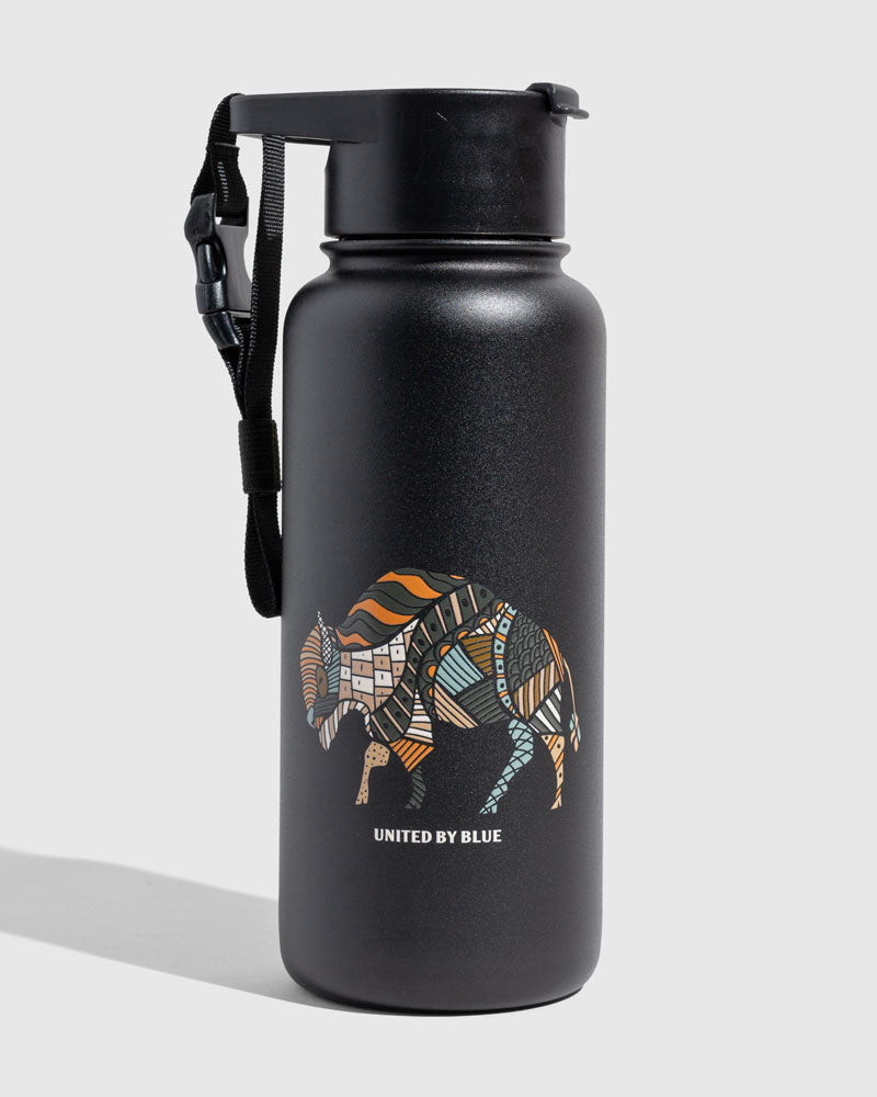 Black - Ink Bottle - 23 Oz. Insulated Stainless Steel (Angle): Matte black bottle with colorful patterned bison graphic and carry strap