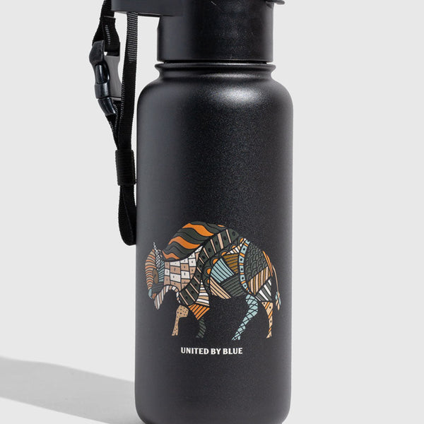 Black - Ink Bottle - 23 Oz. Insulated Stainless Steel (Angle): Matte black bottle with colorful patchwork bison graphic and carrying strap