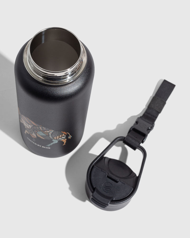 Black - Ink Bottle - 23 Oz. Insulated Stainless Steel (Detail): Matte black steel bottle open, lid with carabiner clip and strap beside
