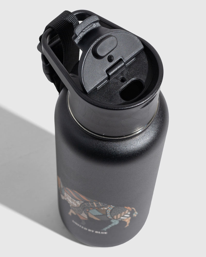 Black - Ink Bottle - 23 Oz. Insulated Stainless Steel (Detail): Black insulated bottle top, open flip lid, carry strap, animal graphic