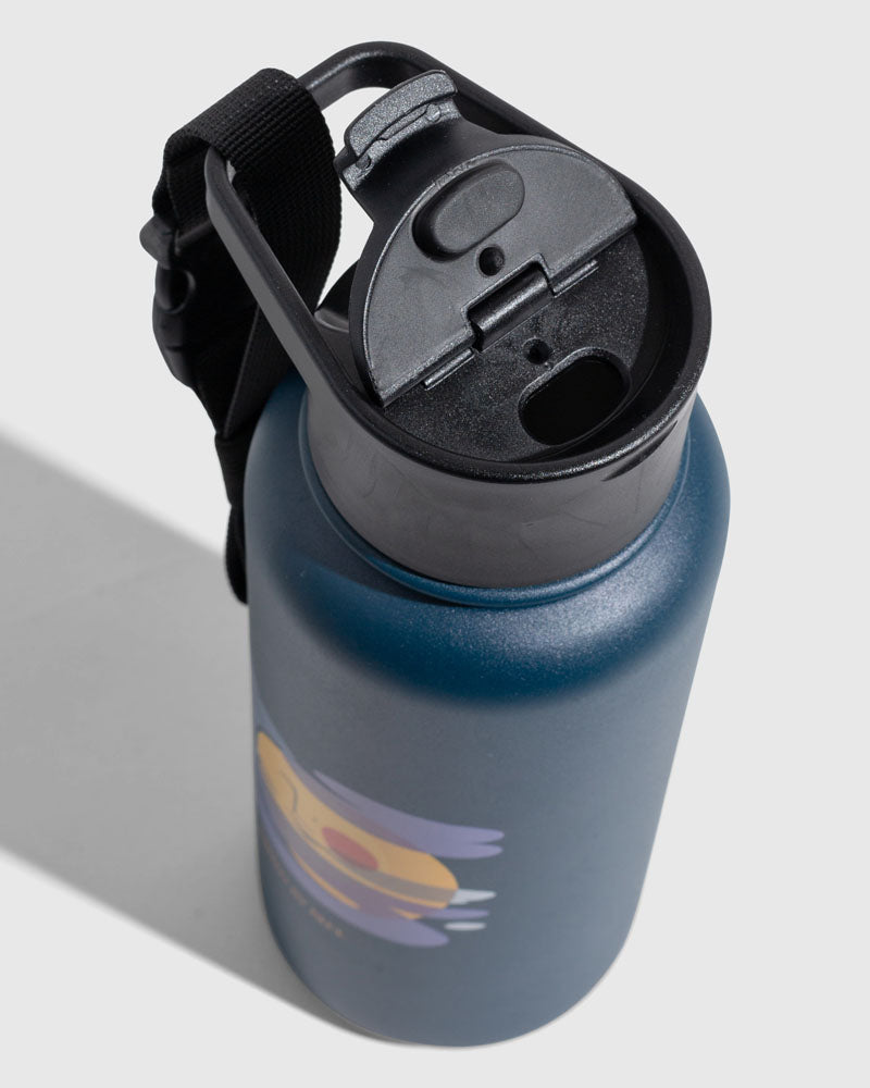 Illuminate Bottle - 23 Oz. Insulated Stainless Steel (Detail): Dark teal bottle top view with black flip-top lid and carry strap