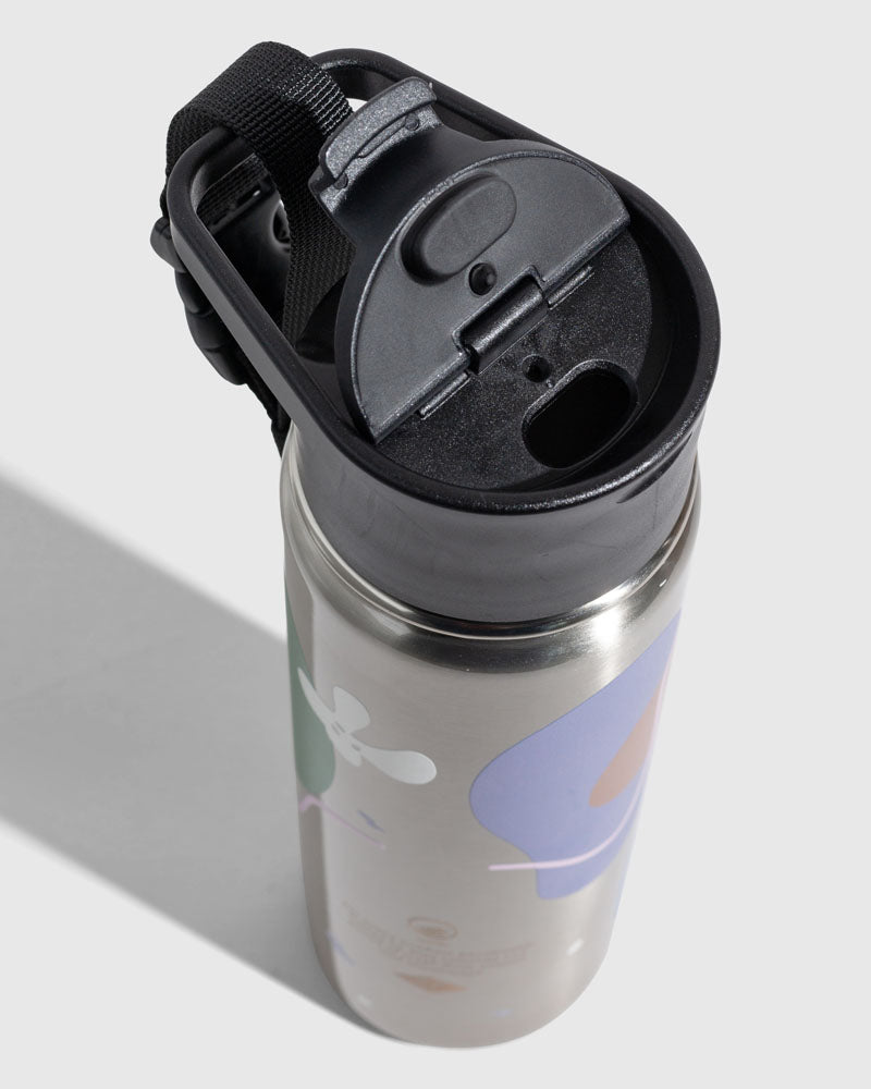 Illuminate Insulated Steel Bottle 32 Oz. (Detail): Top-down view of black flip-top lid with carry strap attached