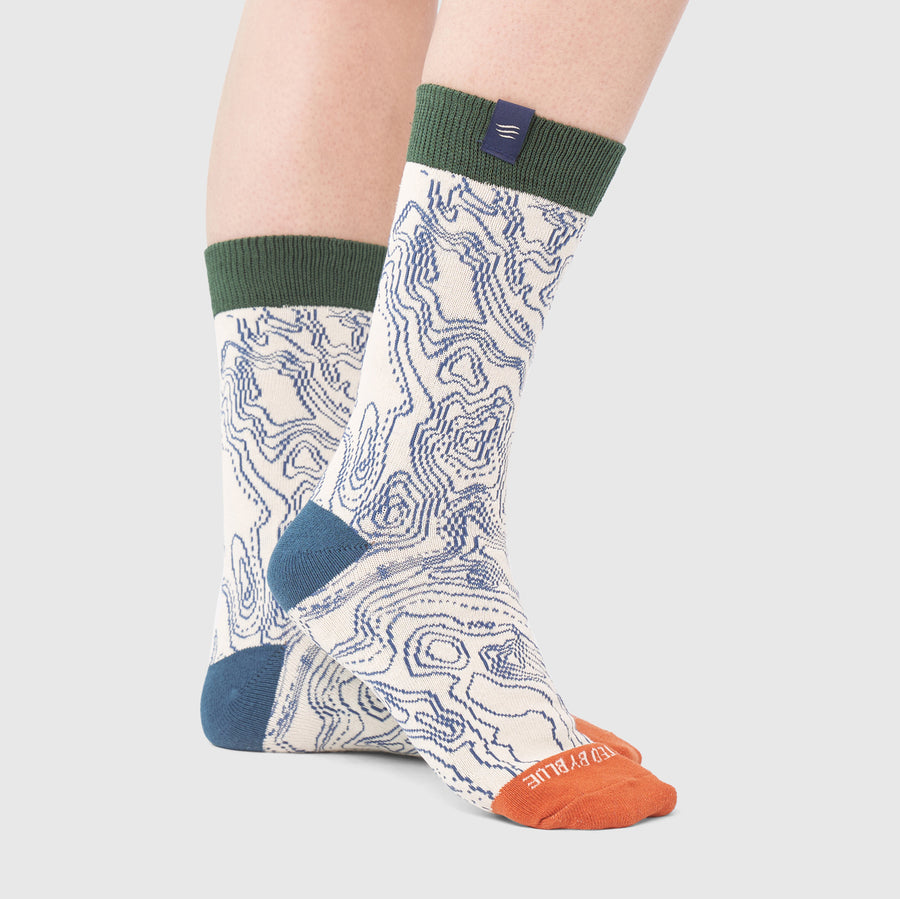 Shortbread IMPACT COLLECTION - Hemp Blend Socks (In-use): Crew socks with topographic map print, green cuff, blue heel, orange toe