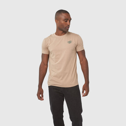 Better Together Graphic Tee (Angle): Tan crew-neck tee with green claw-mark logo on left chest, black pants