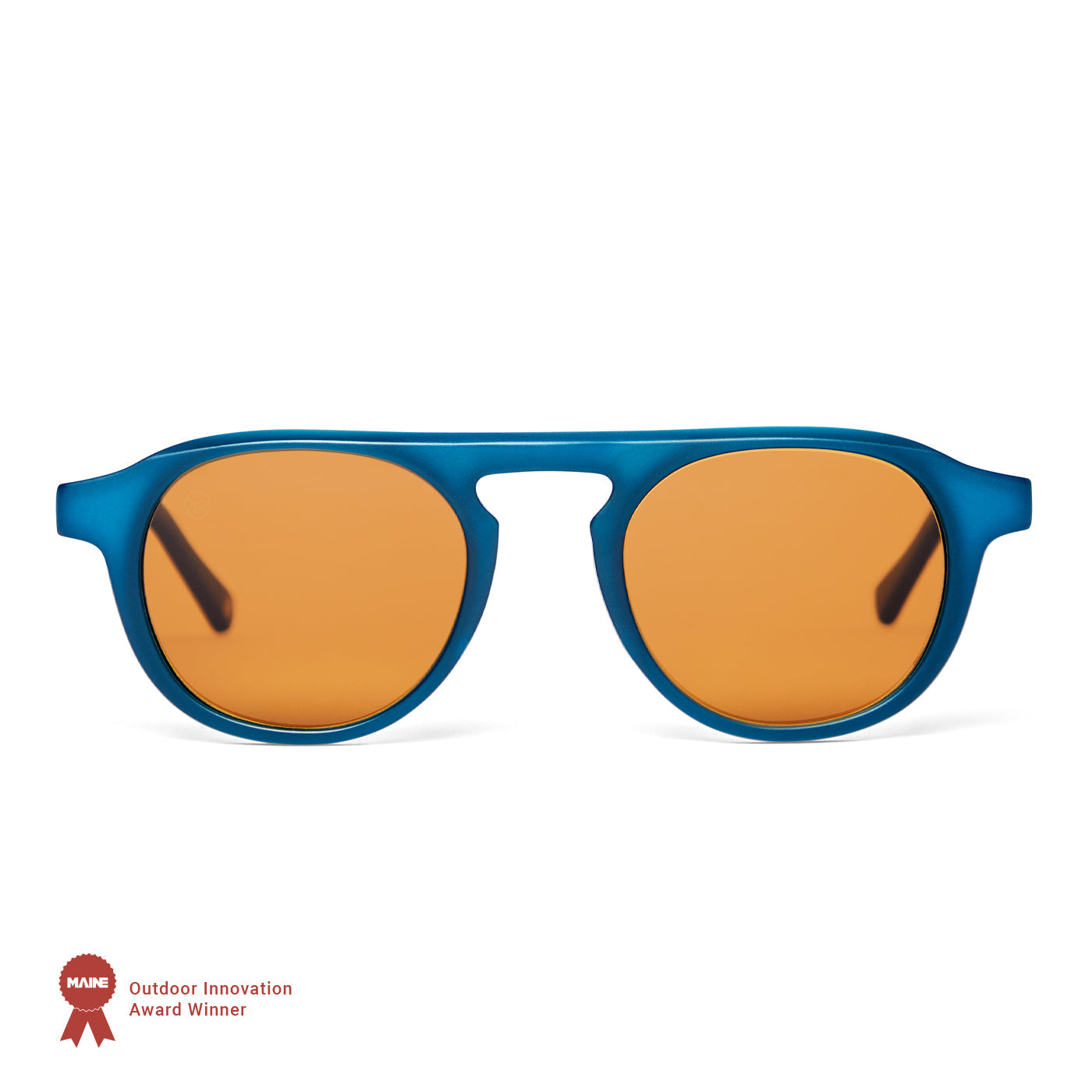 Blue-framed sunglasses with orange lenses on a white background, featuring an award badge.