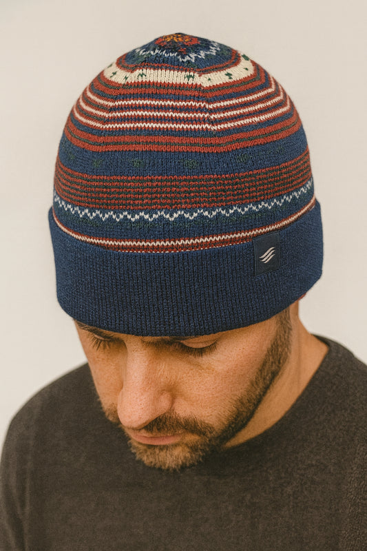Navy Multi Merino Wool Modern Fair Isle Knit Beanie (In-use): Bearded man wearing striped fair isle knit beanie with navy cuff