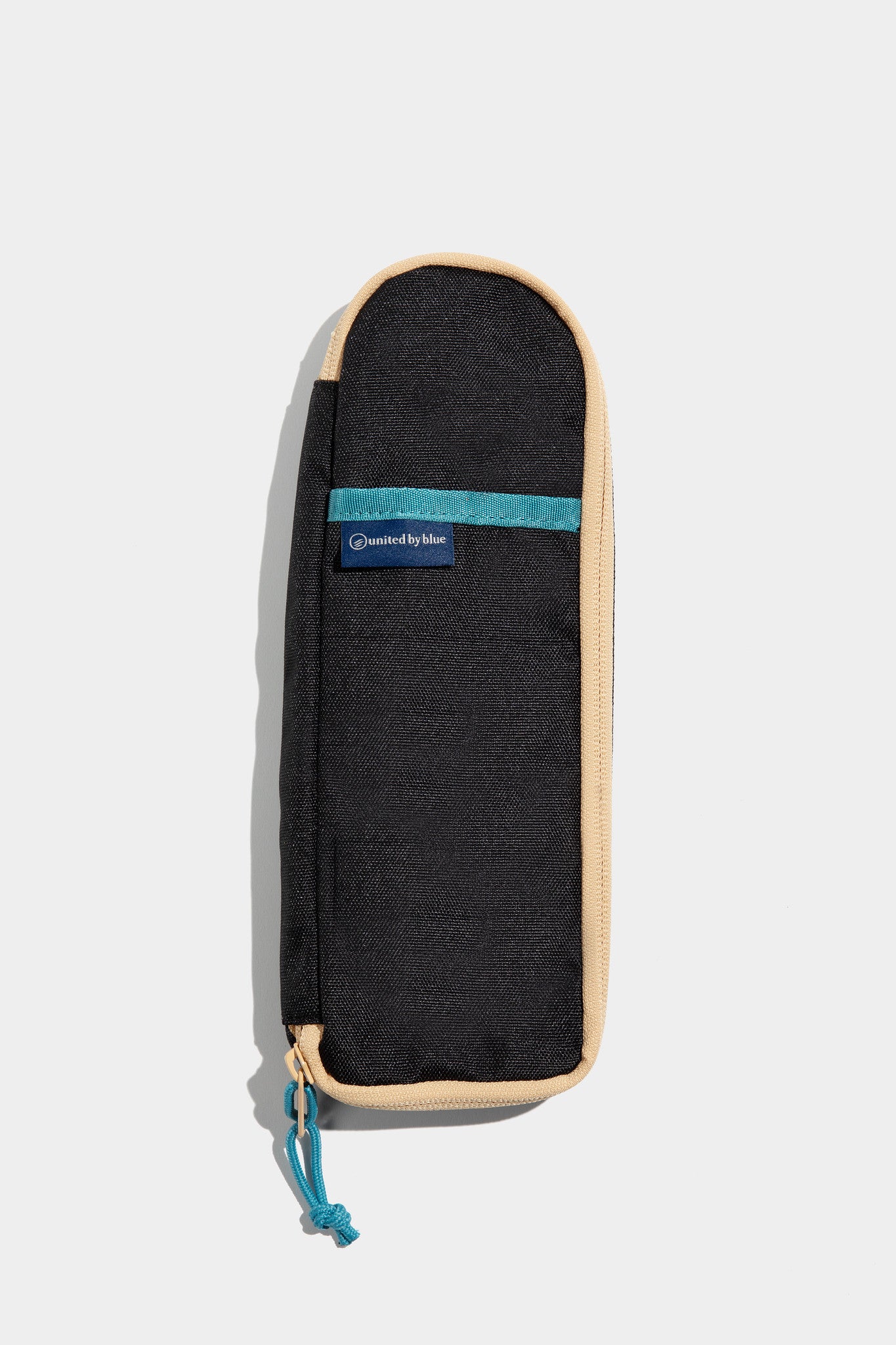Black The Utensil Pack - Perfect for Packed Lunches (Front): Black rectangular case with tan trim, teal zipper pull and brand label