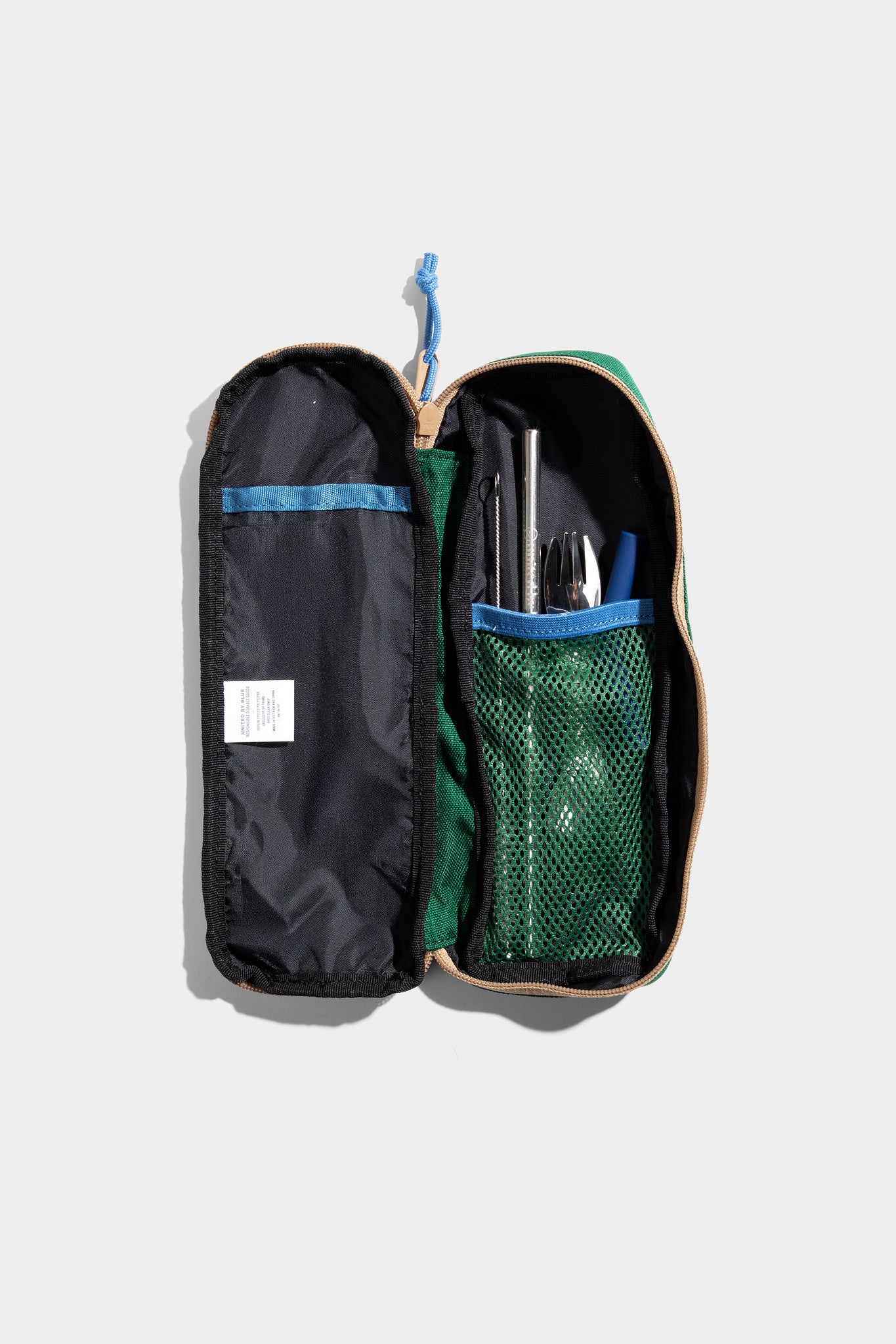 Pine The Utensil Pack - Perfect for Packed Lunches (Detail): Open green case with mesh pocket holding cutlery, straw, and utensils