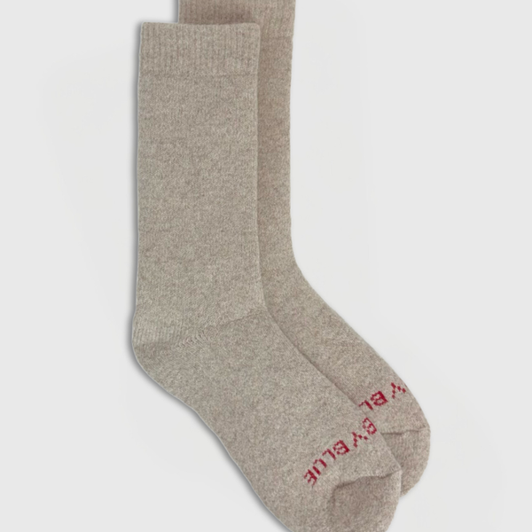 Oatmeal Yak Wool - Ultimate Full Cushion Boot Sock (Flat-lay): Pair of heathered beige crew socks with red logo on toe