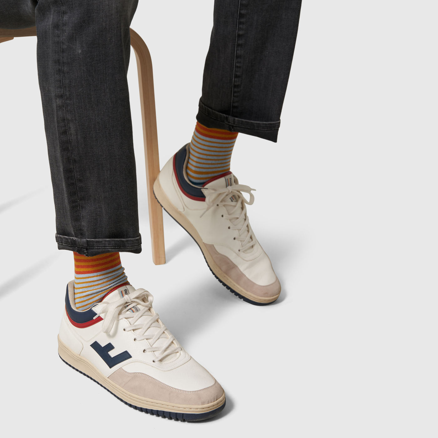 Aqua Stripe IMPACT COLLECTION - Hemp Blend Socks (In-use): Multicolor horizontal striped socks worn with white retro sneakers and dark jeans