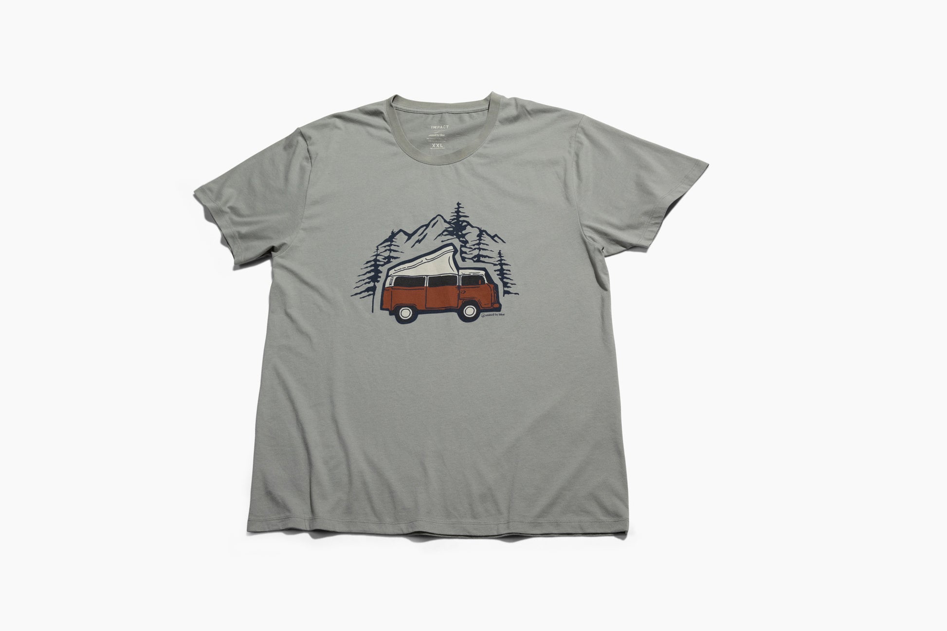 LIMESTONE Adventure Van Graphic Crew (Flat-lay): Sage green tee with rust-colored retro camper van, pine trees, mountains graphic
