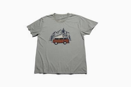LIMESTONE Adventure Van Graphic Crew (Flat-lay): Sage green tee with rust-colored retro camper van, pine trees, mountains graphic