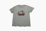 LIMESTONE Adventure Van Graphic Crew (Flat-lay): Sage green tee with rust-colored retro camper van, pine trees, mountains graphic