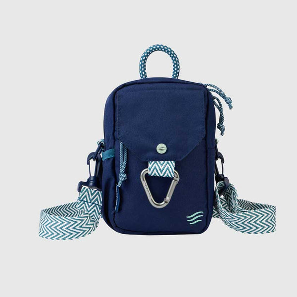Navy (R)evolution™ Daily Cross Body (Front): Navy crossbody bag with chevron strap, carabiner clip, and rope handle